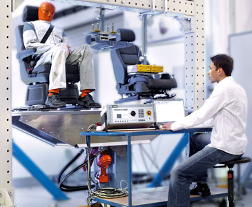 Seat test stand with dummy in use Photo of seat test stand with dummy