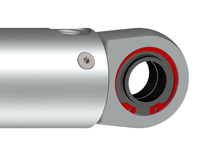 Spherical plain bearing with retaining ring